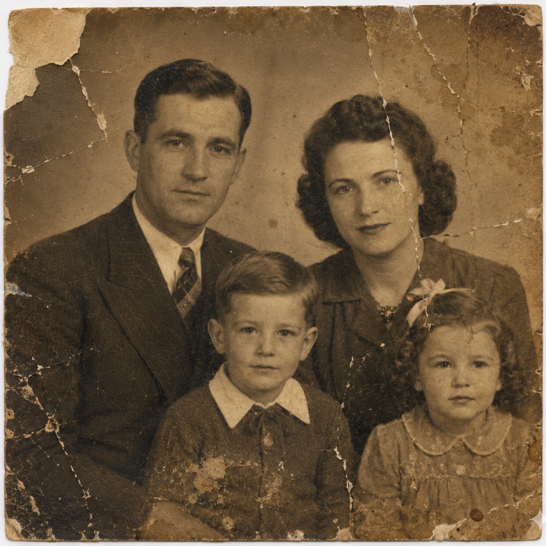 Faded old family portrait ready for digital restoration